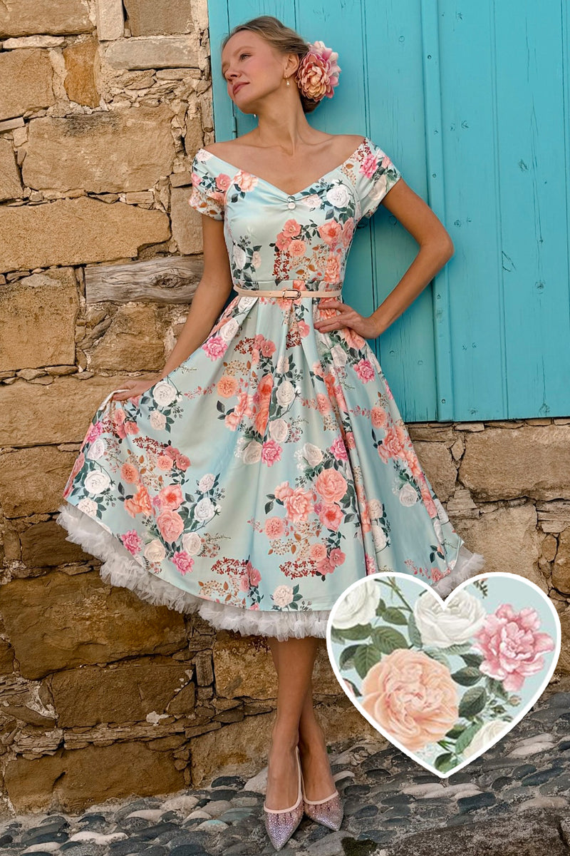 A lady wearing a 50s Style Floral Off Shoulder Dress In Mint