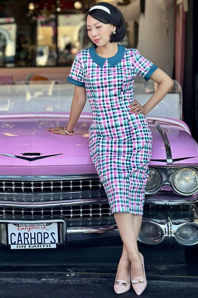 A model wearing a 50s Style Pink & Green Check Collar Dress