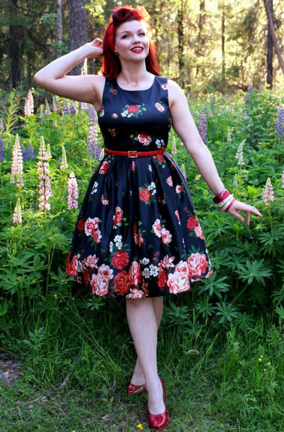 A model wearing Floral Roses Satin Flared Dress in Black-Pink