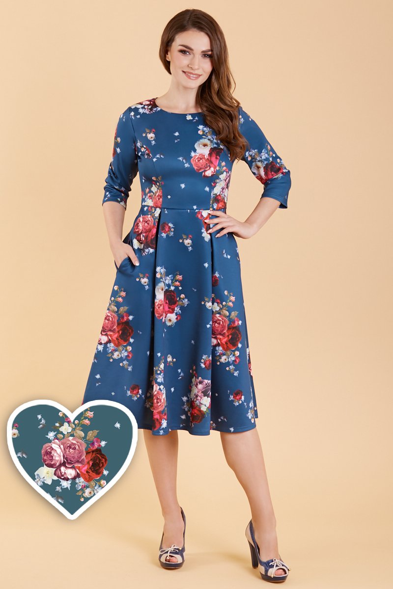 A model wearing Long Sleeved Navy & Red Floral Midi Dress