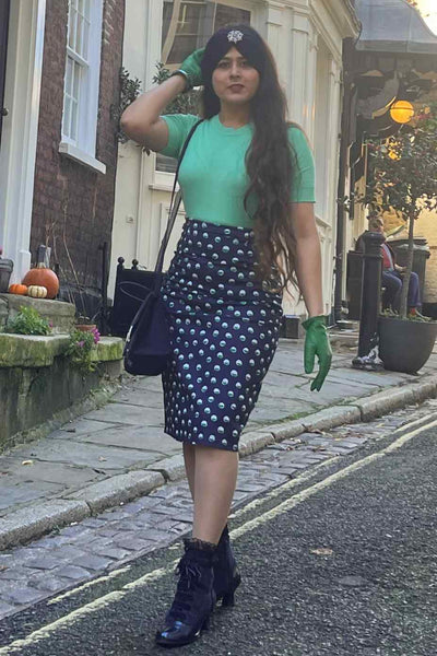 A model wearing Navy Pencil Skirt With White & Green Polka Dots