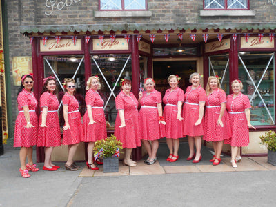 Singers wearing a Pin Up Style Shirt Dress In Classic Red & White Polka Dots