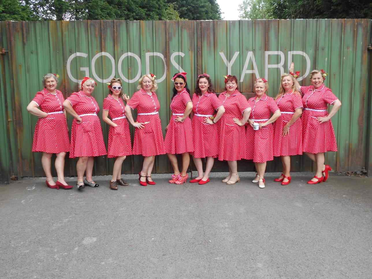 Singers wearing a Pin Up Style Shirt Dress In Classic Red & White Polka Dots