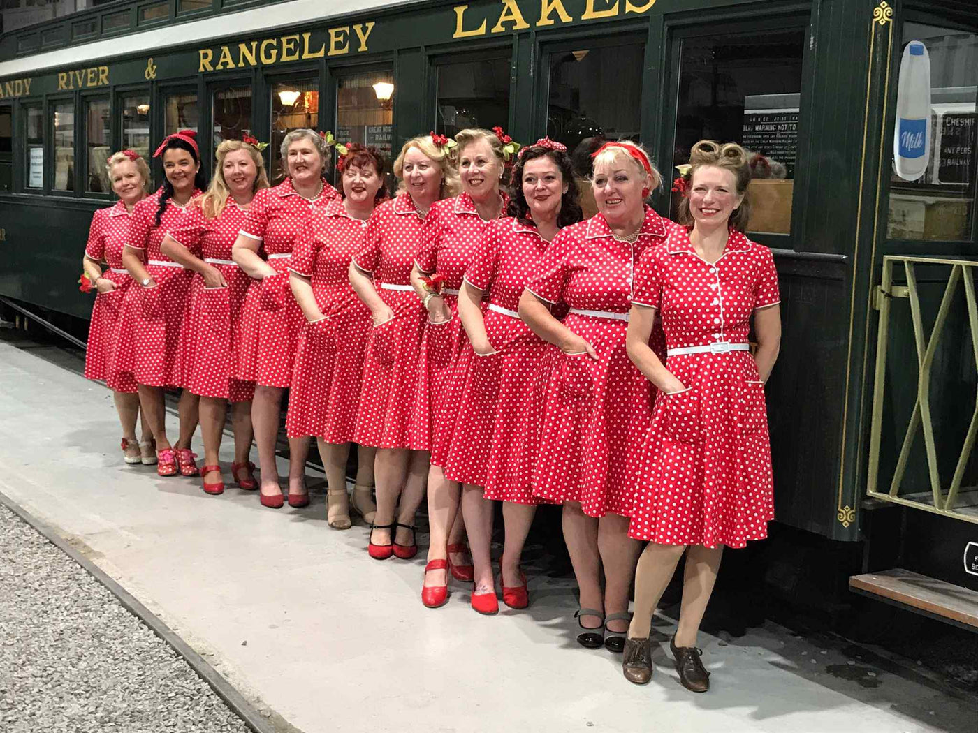 Singers wearing a Pin Up Style Shirt Dress In Classic Red & White Polka Dots