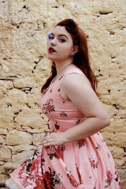 A model wearing Raising Flowers Swing Dress in Pink