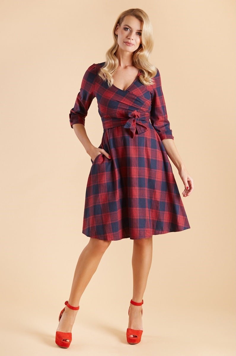 Model wearing red blue tartan sleeved flared dress