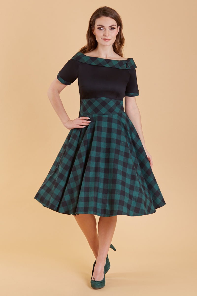 A model wearing Retro Black & Green Tartan Swing Dress