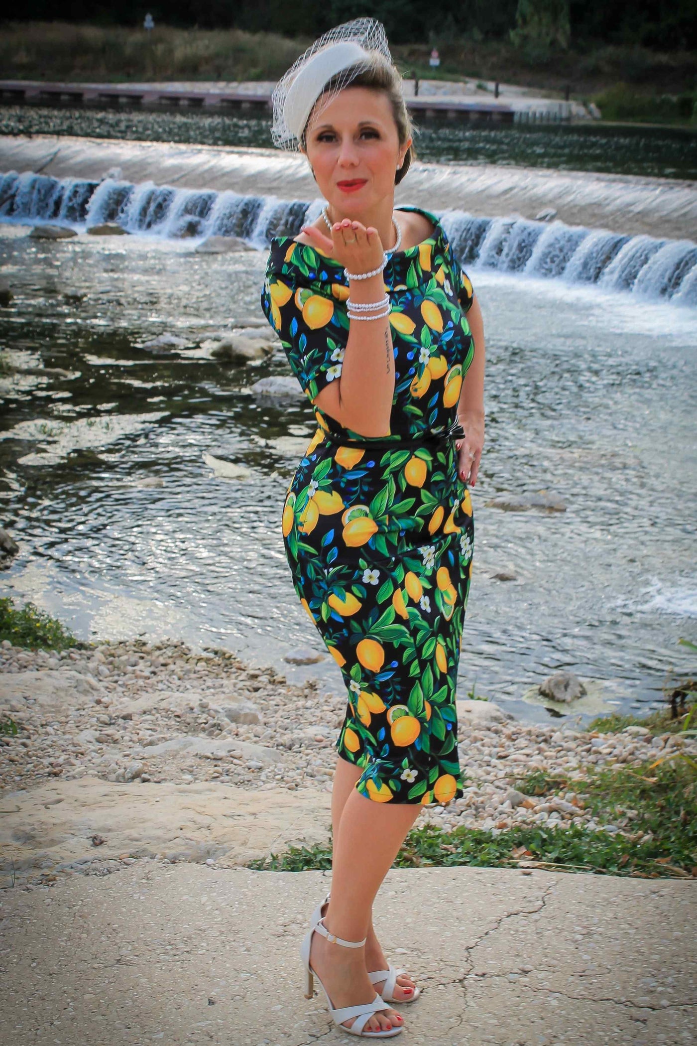 A model wearing a Summer Lemon Fitted Off Shoulder Dress