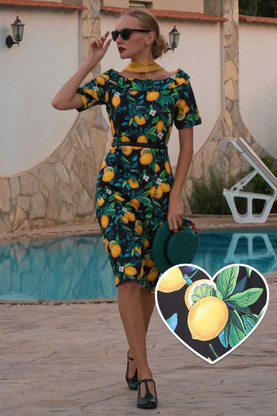 A lady wearing a Summer Lemon Fitted Off Shoulder Dress