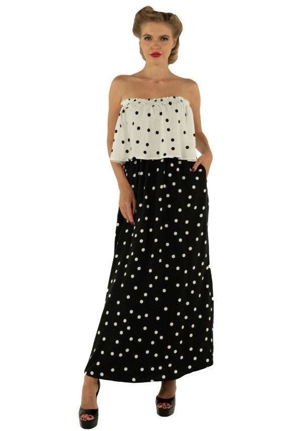 A model wearing Two-Way Off-Shoulder Maxi Dress in Polka Dot Print