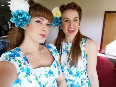 Customers wearing white/blue floral dress