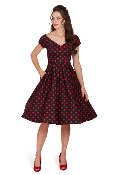 Model wearing a Rockabilly Polka Dot Off Shoulder Swing Dress In Black & Red