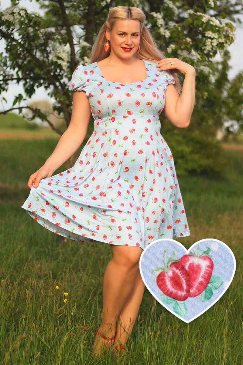 A model wearing Baby Blue Swing Dress with Strawberries & Dots