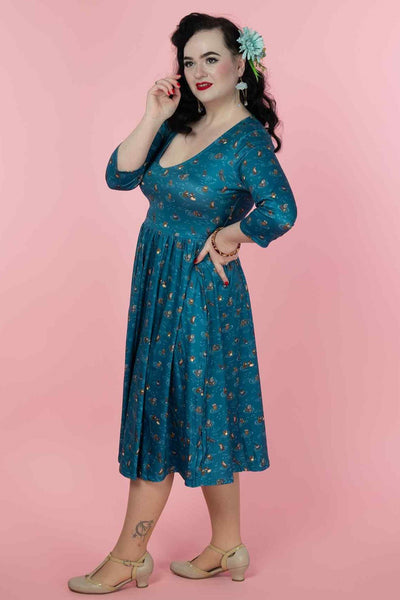 A model wearing a Long Sleeved Blue Otter Family Dress