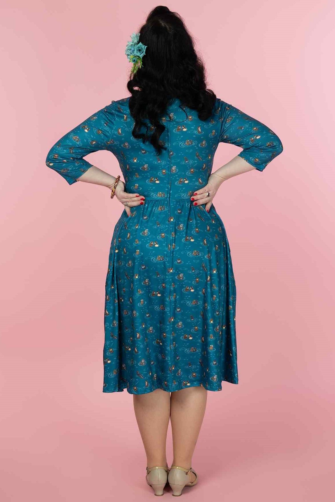 A model wearing a Long Sleeved Blue Otter Family Dress