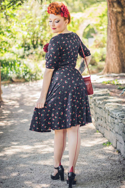 A model waring a Black Cherry Wrap Dress