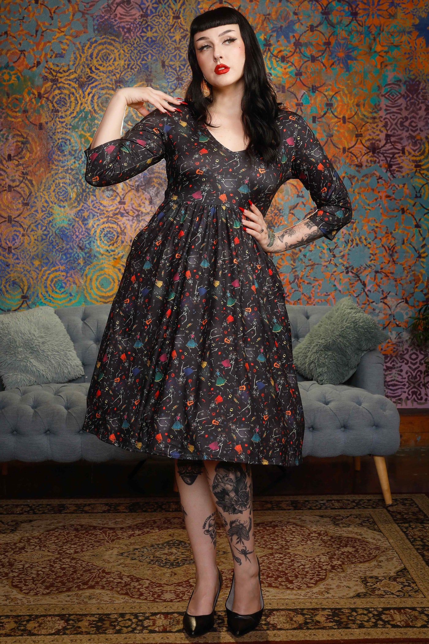 A model wearing a Black Day Of The Dead Dress