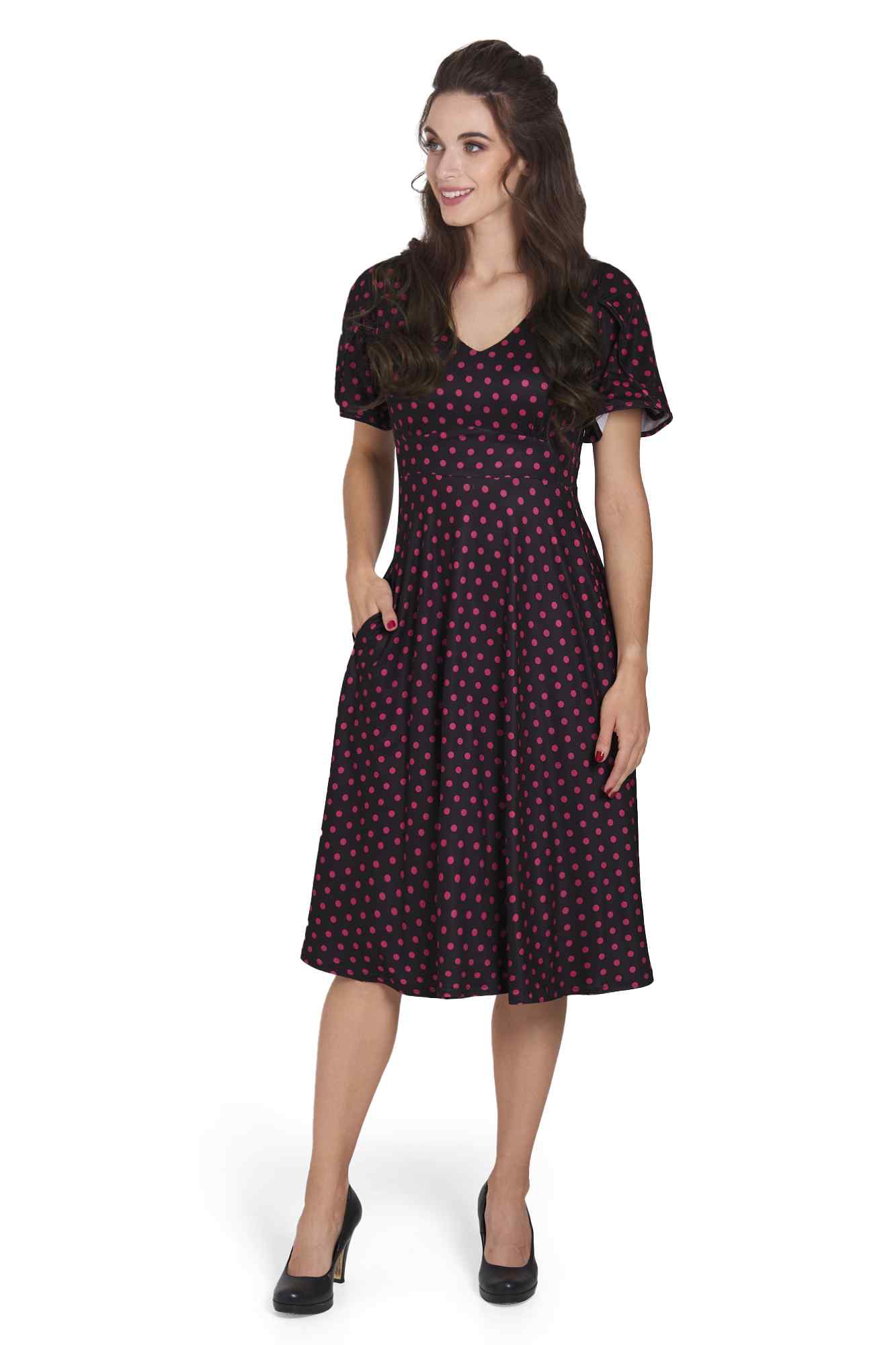 Model wearing Sleeved Flared Tea Dress in Black Polka Dot Print