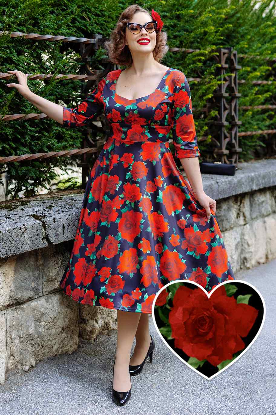 A model wearing a Black/Red Rose Long Sleeved Midi Dress