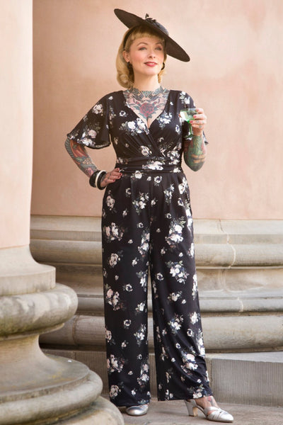 A model wearing Black Rose Butterfly Sleeved Jumpsuit