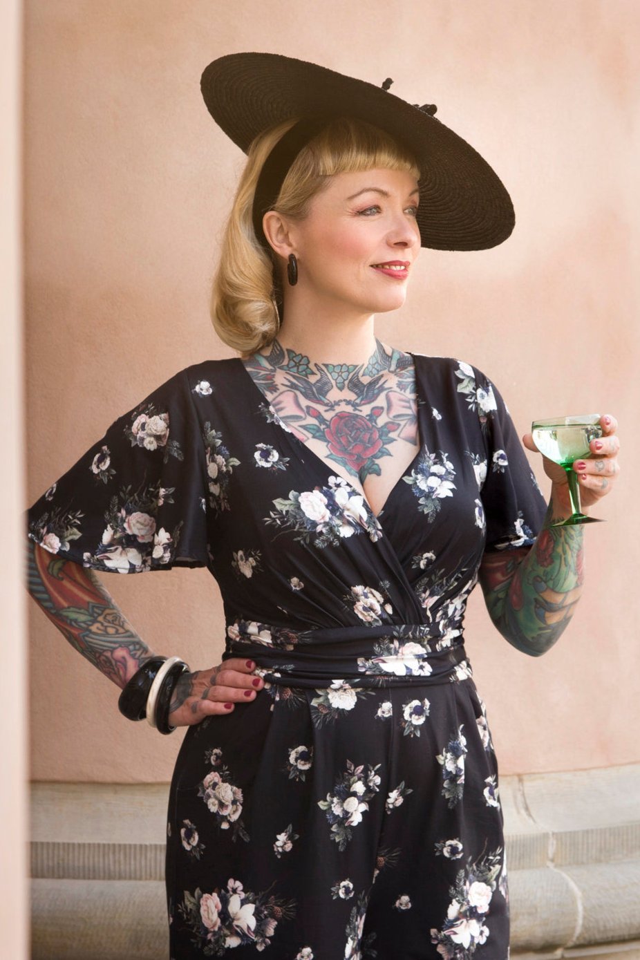 A model wearing Black Rose Butterfly Sleeved Jumpsuit