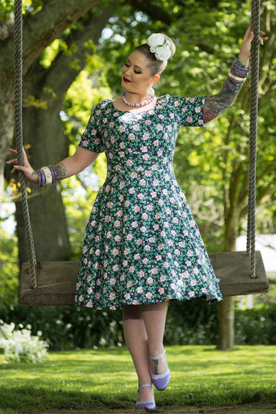 A model wearing Black/Purple Floral Flared Day Dress