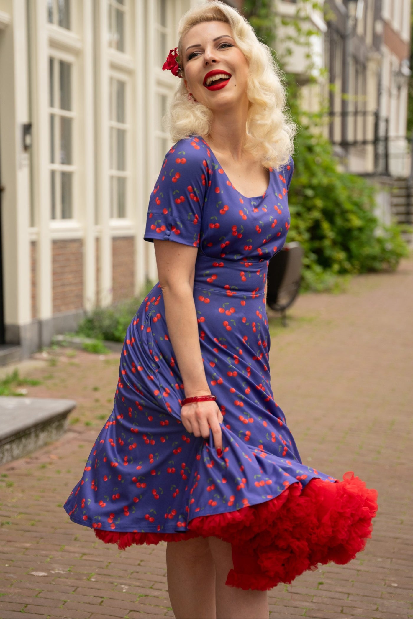 A model wearing a Blue Cherry Flared Dress