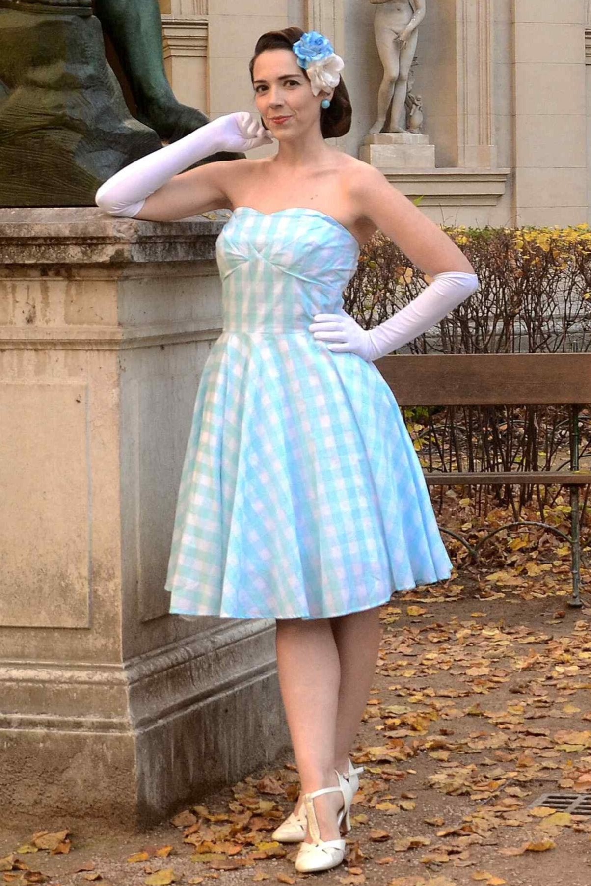 A model wearing Blue Gingham Strapless Dress