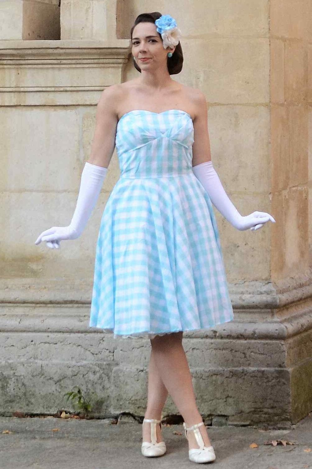 A model wearing Blue Gingham Strapless Dress