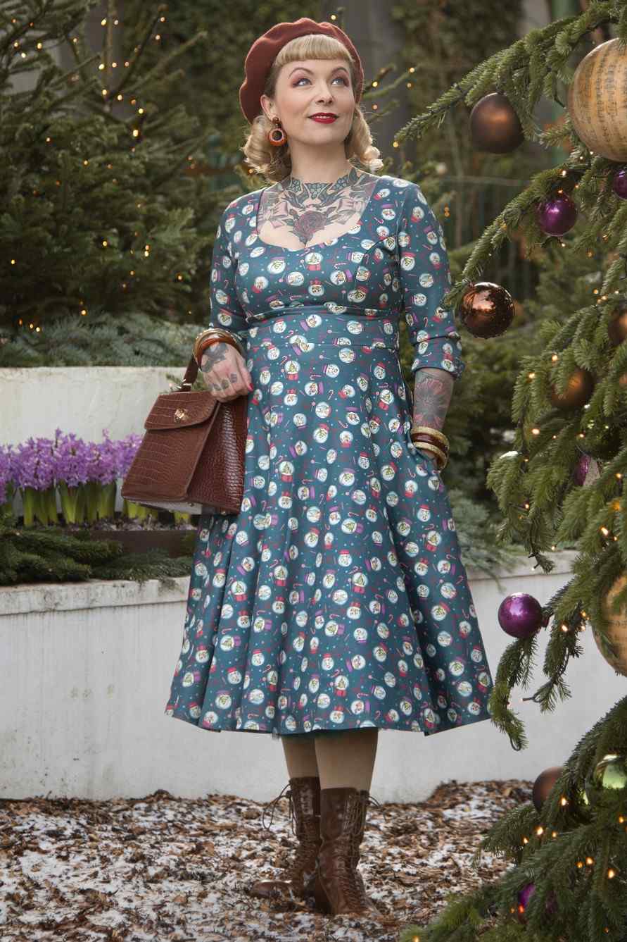 Front view of model wearing Blue Snow Globe Long Sleeved Dress