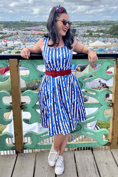 A lady wearing a Blue Striped Rockabilly Swallow Swing Dress