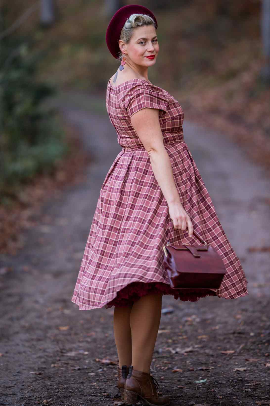 A model wearing Burgundy Tartan Off Shoulder Swing Dress