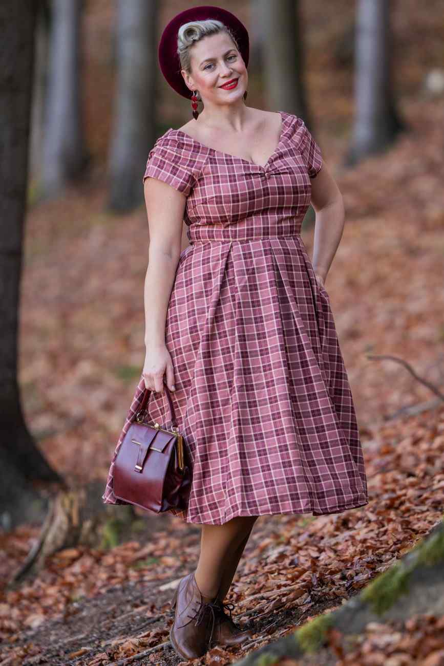 A model wearing Burgundy Tartan Off Shoulder Swing Dress