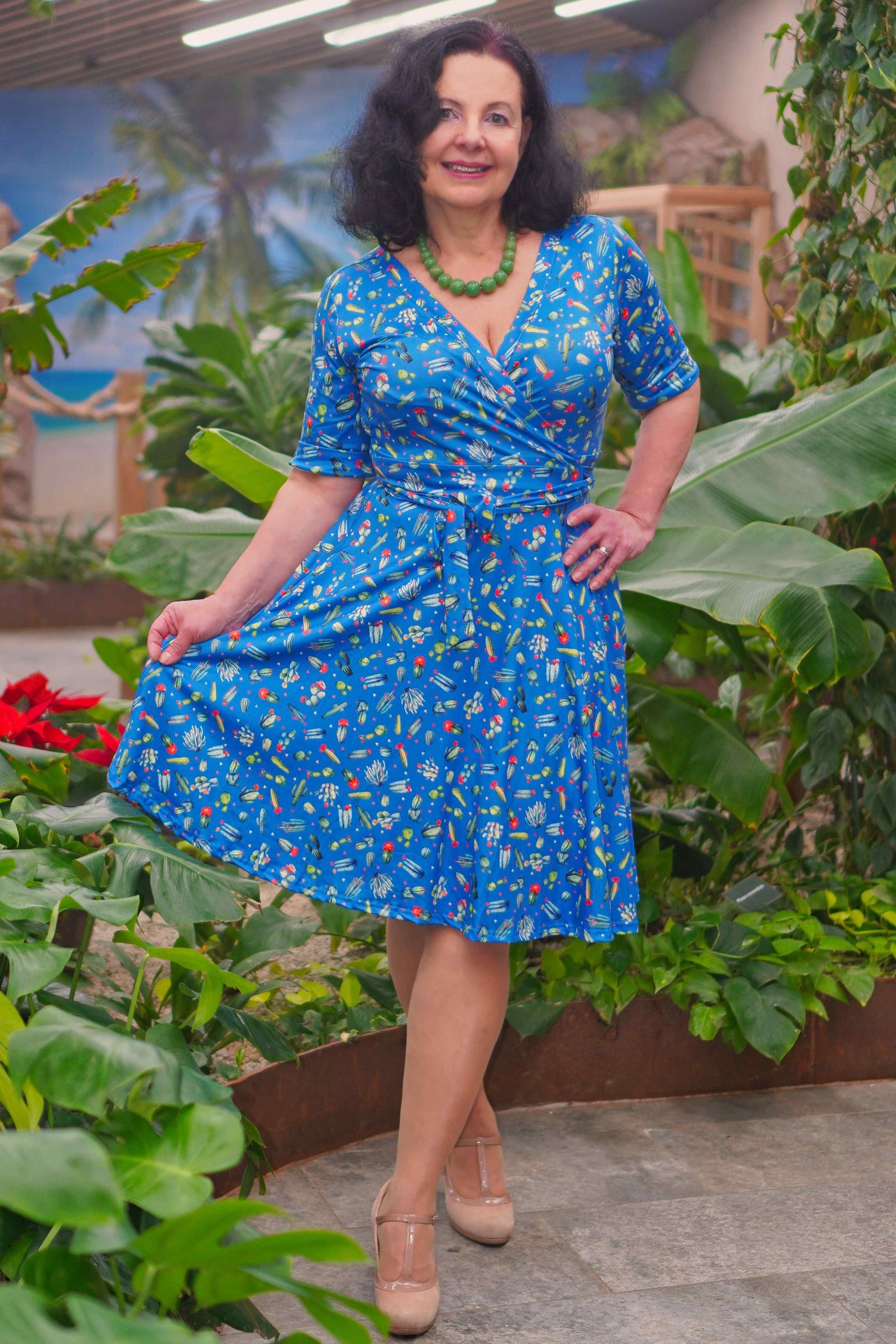 A lady wearing a Cactus Blue Wrap Dress