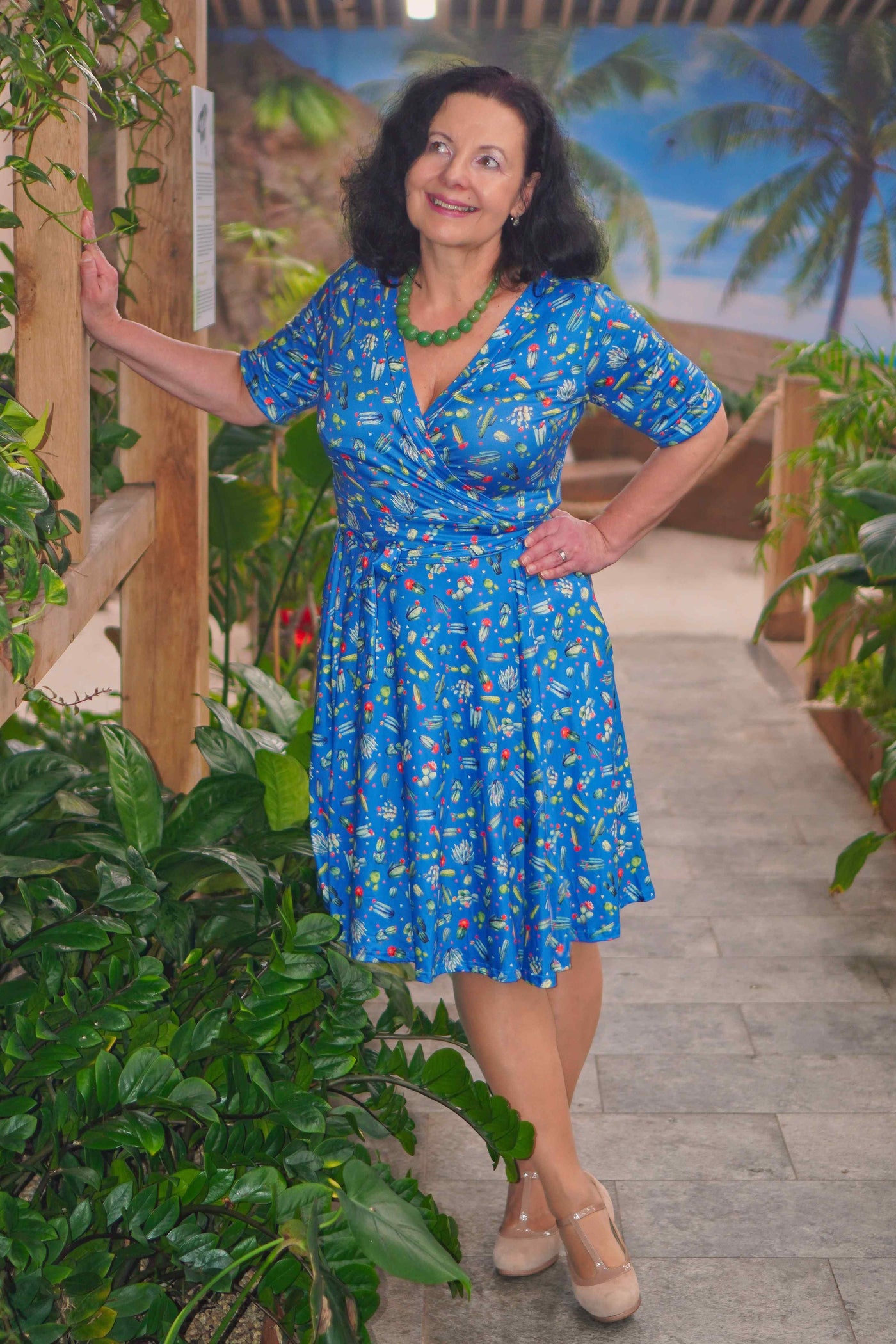 A lady wearing a Cactus Blue Wrap Dress