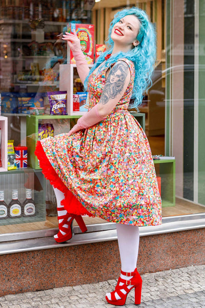 A lady wearing a Candyland Swing Dress