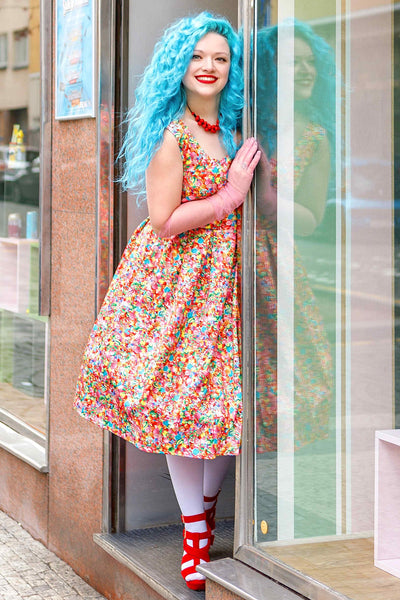 A lady wearing a Candyland Swing Dress