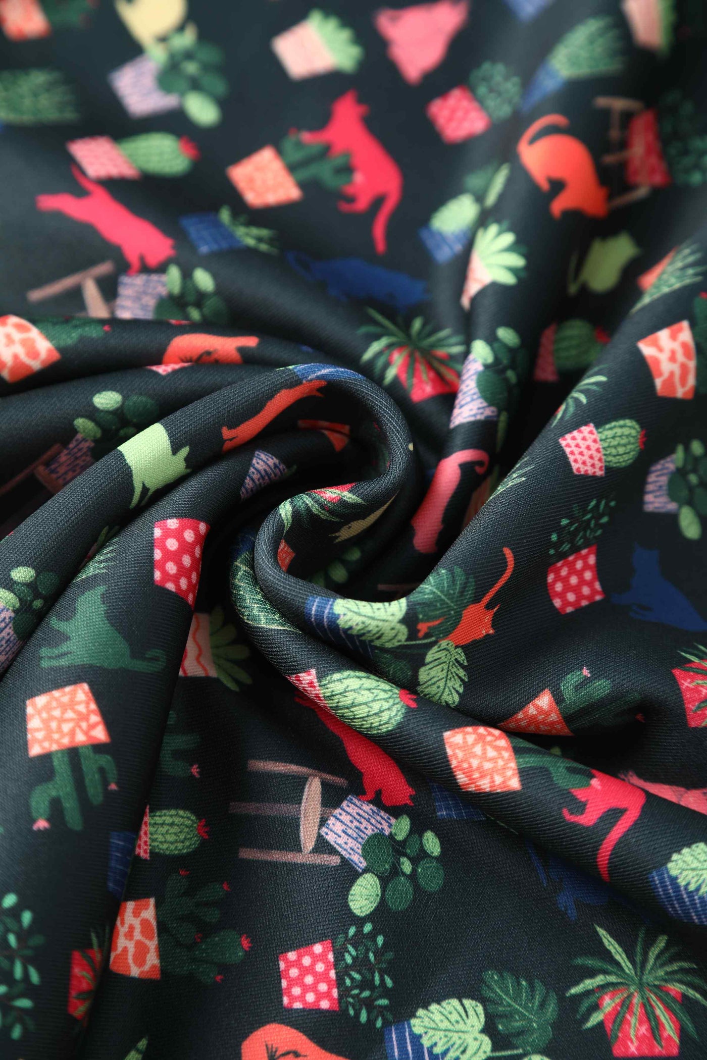 Close up view of Cat & Plant Dress In Dark Green