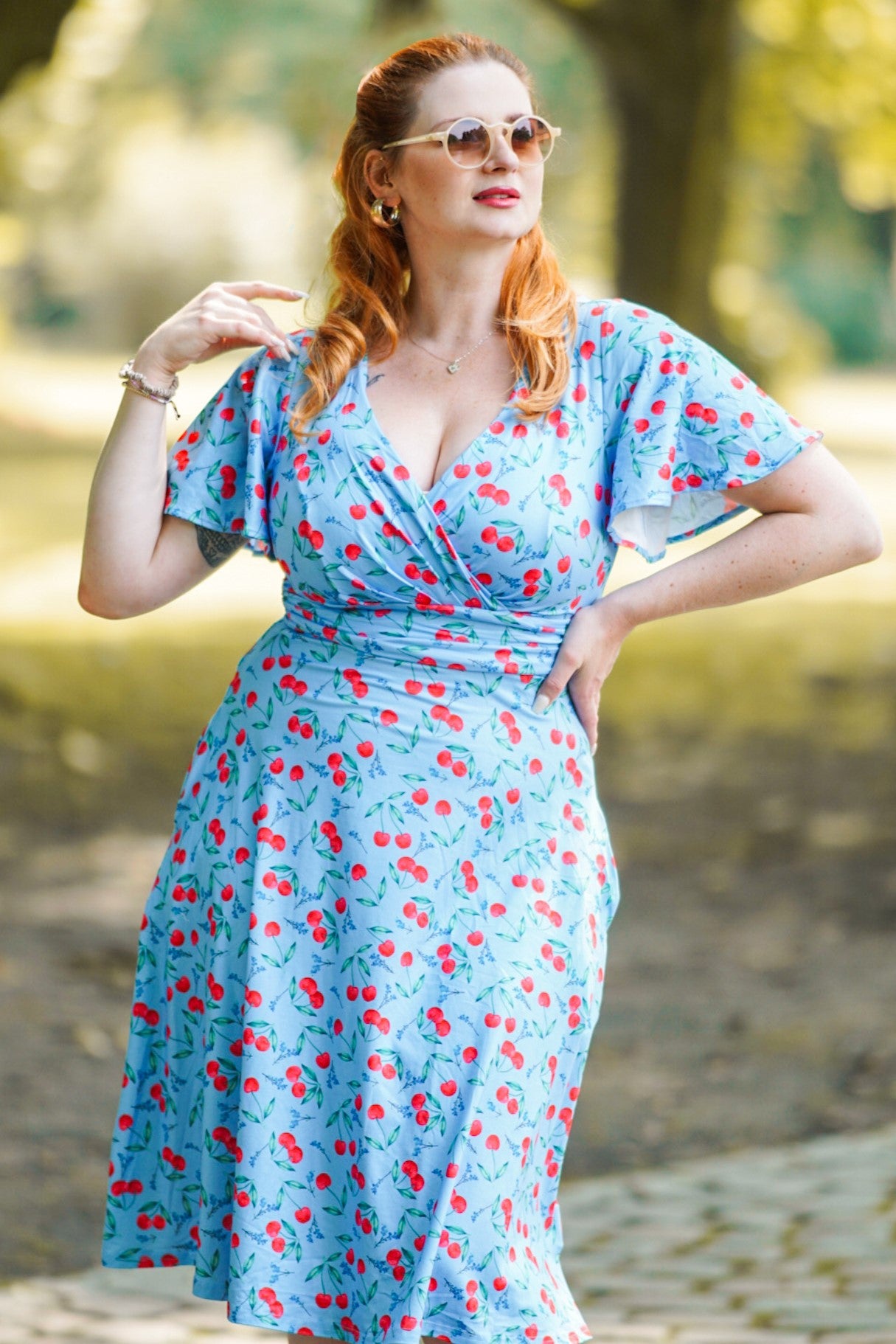 A model wearing a Blue Cherry Summer Tea Dress