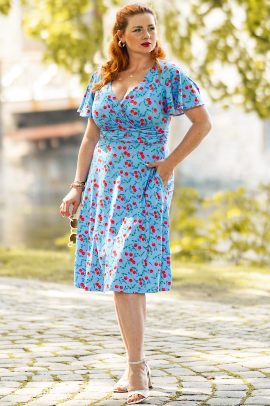 A model wearing a Blue Cherry Summer Tea Dress