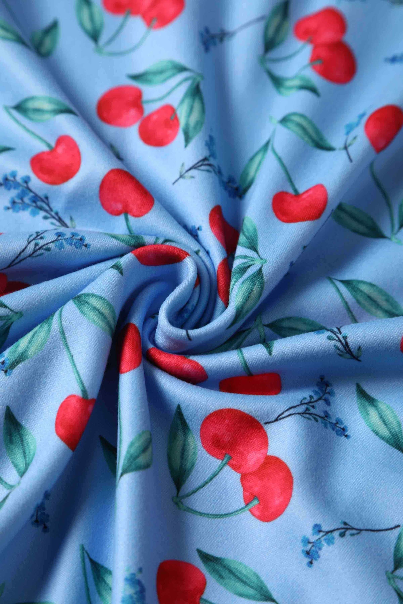 Close up view of Cherry Print Summer Tea Dress in Blue