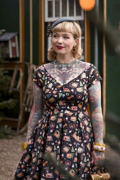 A model wearing Christmas Fair Off Shoulder Dress