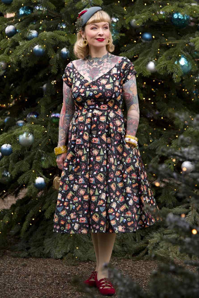 A model wearing Christmas Fair Off Shoulder Dress