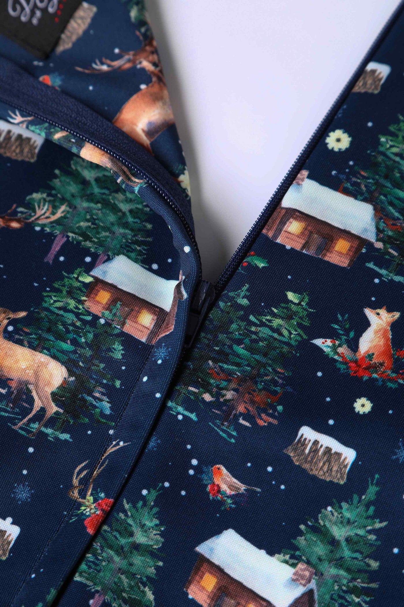 Close up view of Christmas Reindeer Midi Dress On Navy Blue