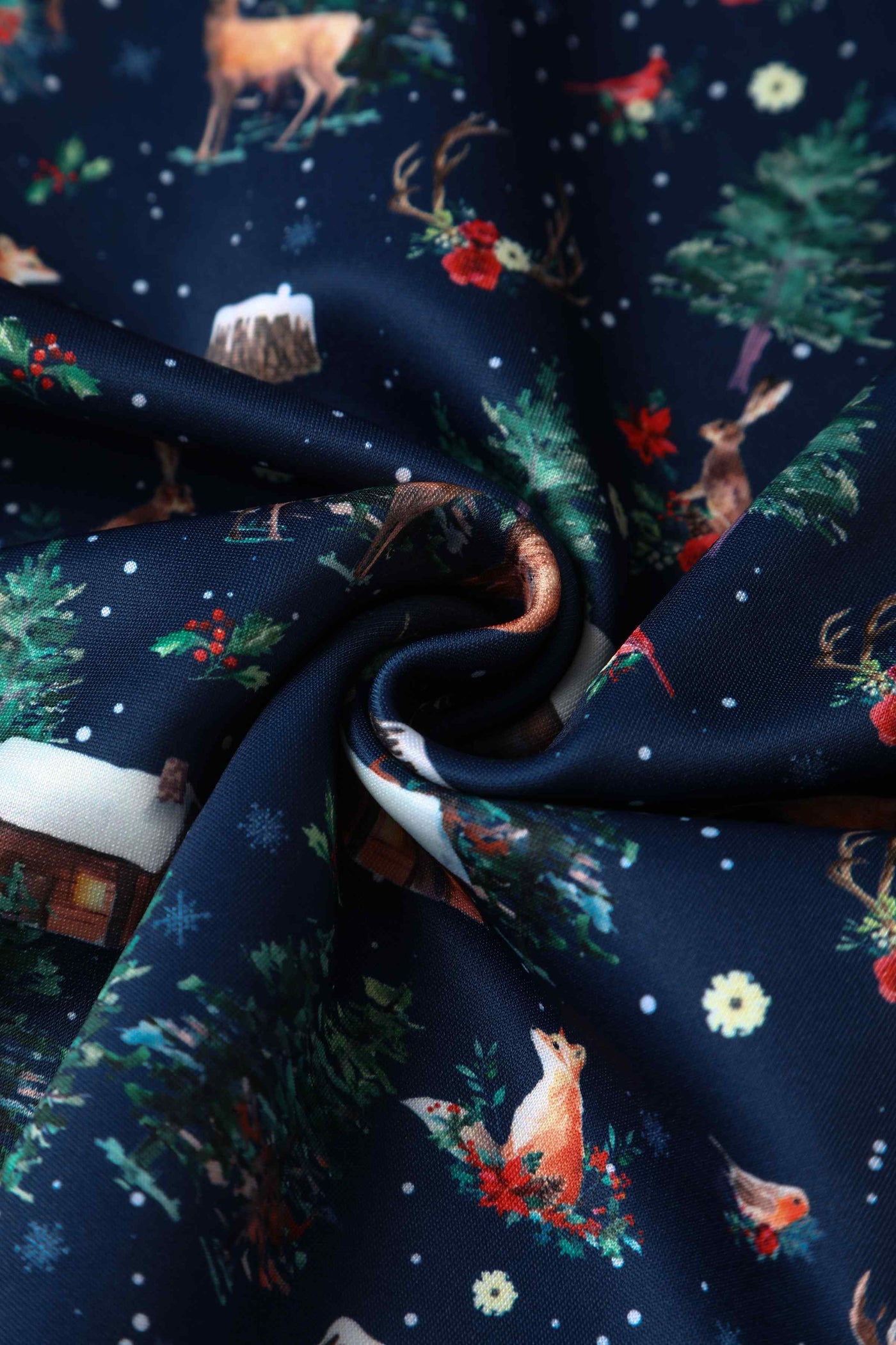 Close up view of Christmas Reindeer Midi Dress On Navy Blue