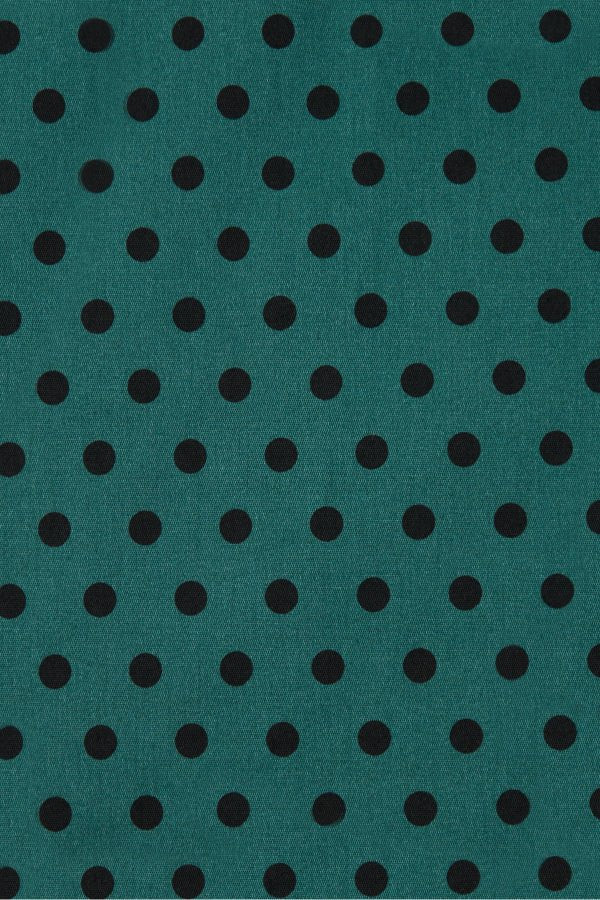 Close up view of Coat Dress in Green & Black Polka Dots