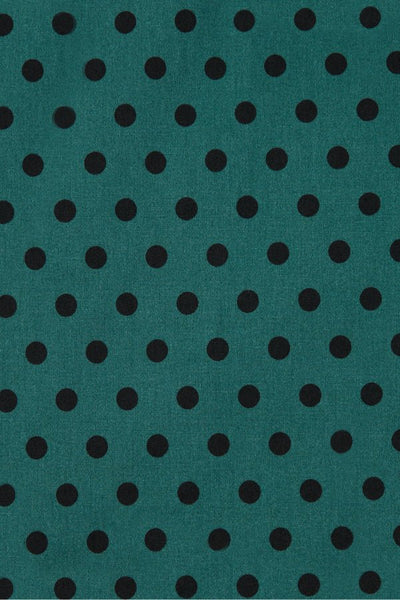 Close up view of Coat Dress in Green & Black Polka Dots