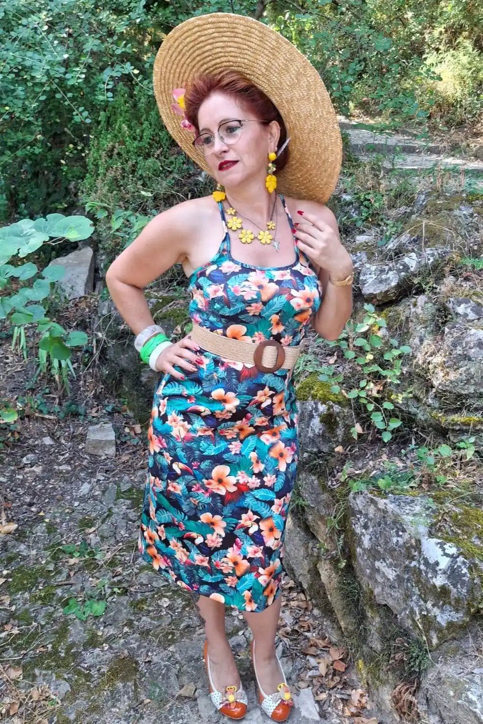 A model wearing a Cross Strap Pencil Dress in Black Toucan Print