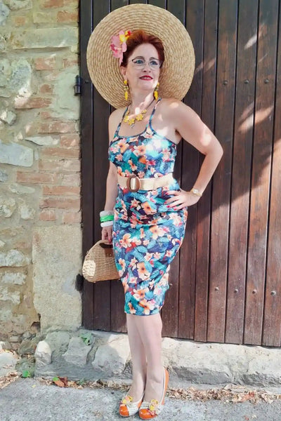 A model wearing a Cross Strap Pencil Dress in Black Toucan Print