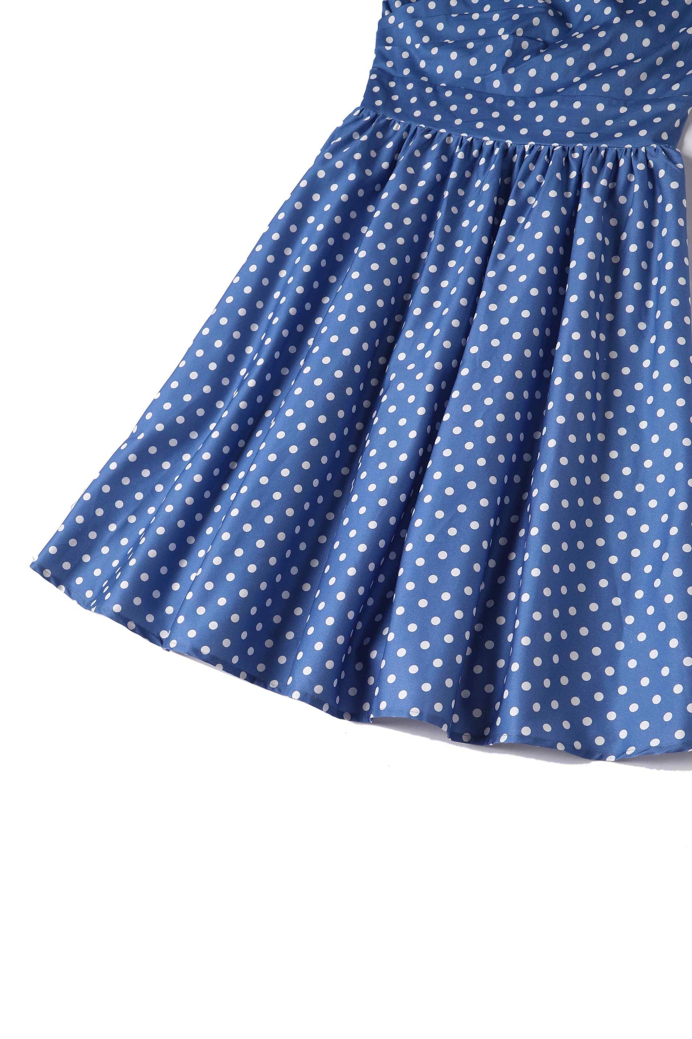 Close up view of Crossover Bust Blue and White Polka Dot Dress